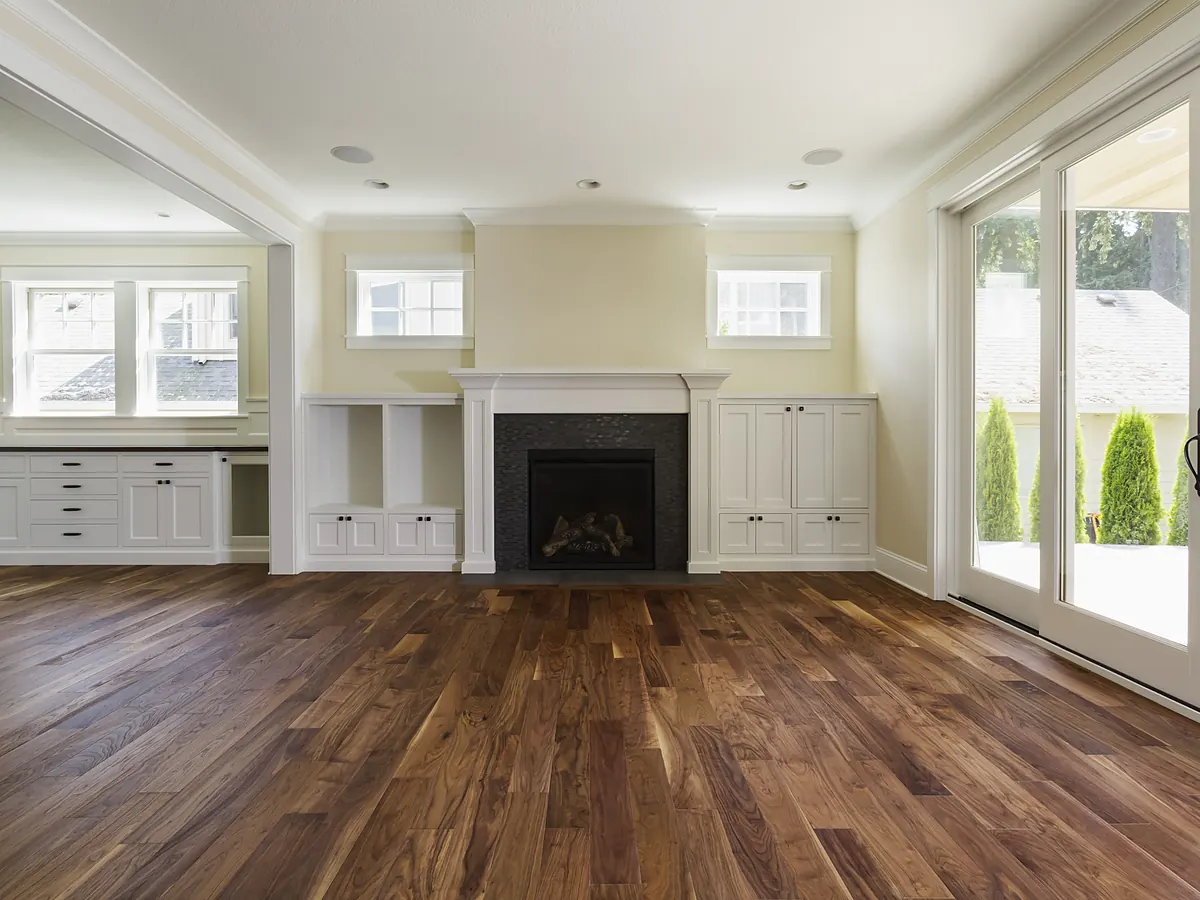 Dark-stained hardwood floor in a Sioux Falls, SD living room with a fireplace