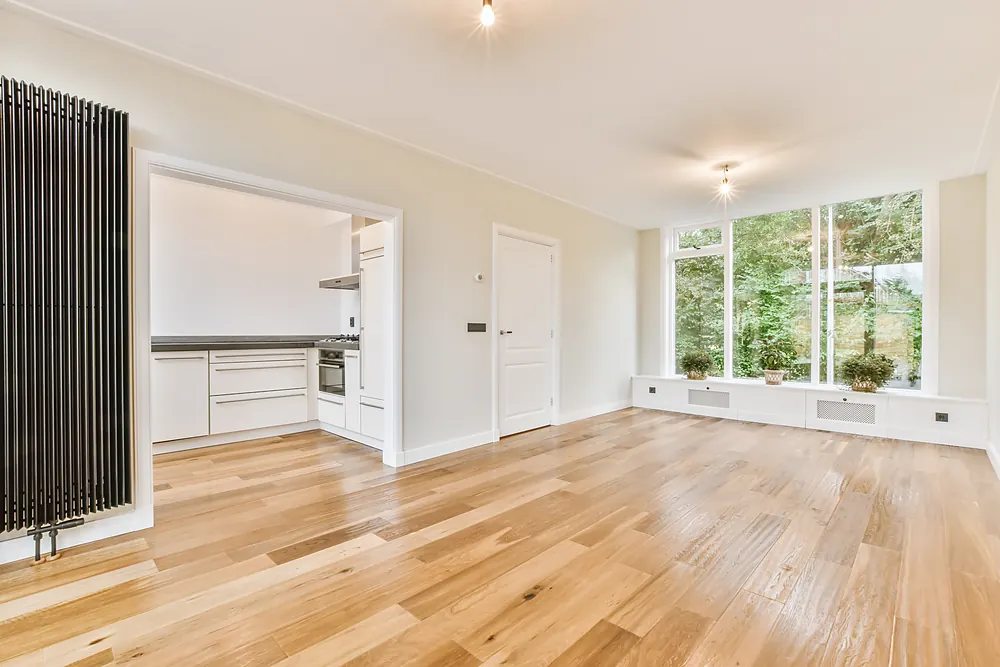 Hardwood floor running through an open-plan kitchen and living room in Sioux Falls, SD