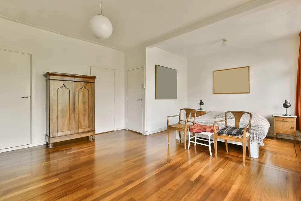 Warm oak hardwood floor in a light-filled Sioux Falls, SD bedroom